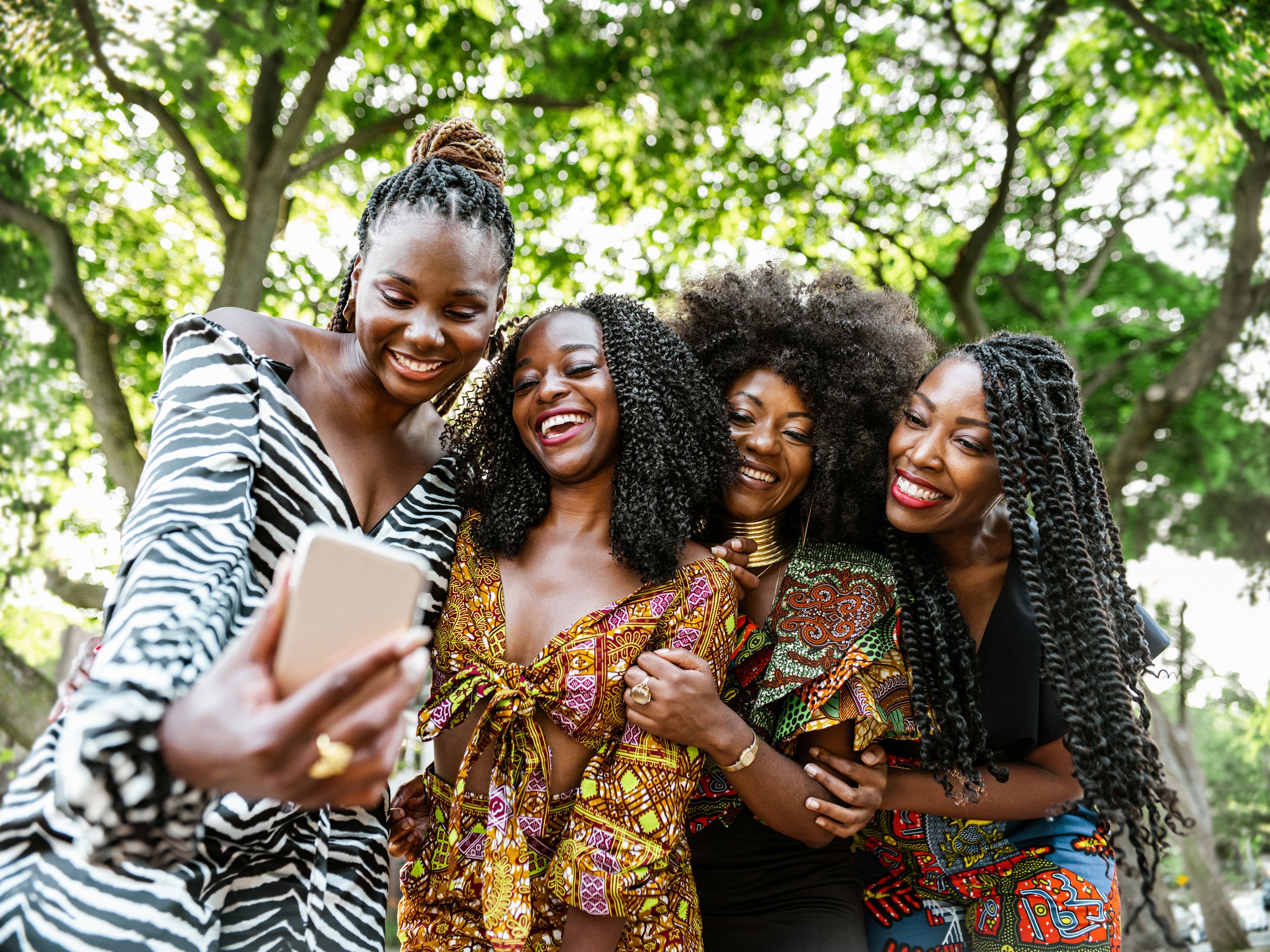 Young black women in city park taking selfie